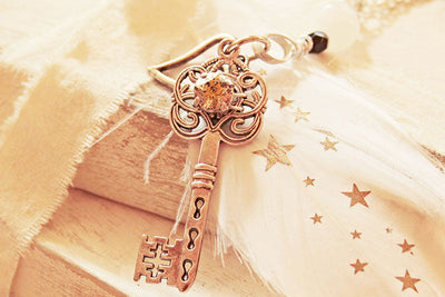 Charm Secrets: The Meaning of the Key Symbol